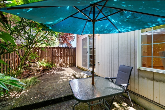 view of patio with fence