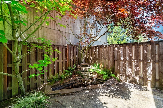 view of yard with a fenced backyard and a patio