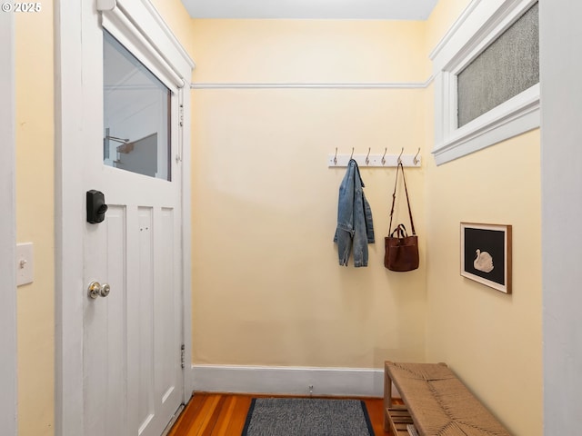 2127 NW Irving St Unit 104, Portland, OR 97210 - doorway with wood finished floors and baseboards