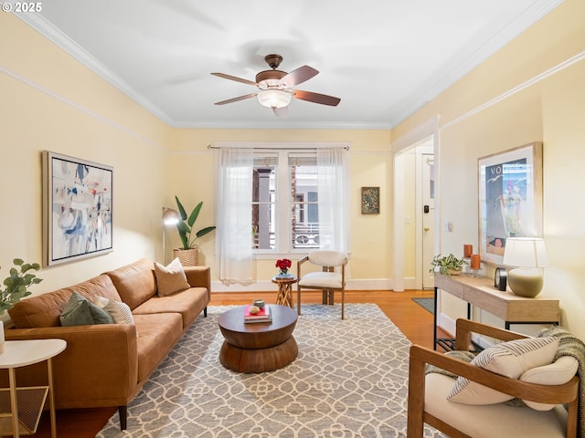 2127 NW Irving St Unit 104, Portland, OR 97210 - living area featuring crown molding, a ceiling fan, light wood-style flooring, and baseboards