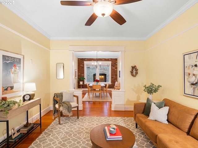 2127 NW Irving St Unit 104, Portland, OR 97210 - living room with wood finished floors, crown molding, ceiling fan, and baseboards