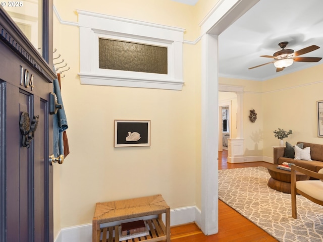2127 NW Irving St Unit 104, Portland, OR 97210 - corridor featuring wood finished floors, baseboards, and ornamental molding