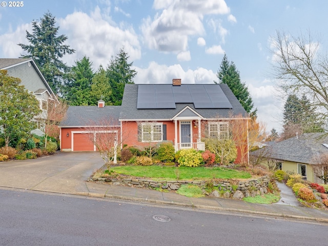 view of front of house with solar panels and a garage