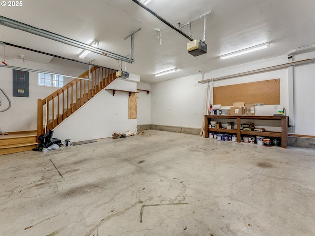 garage featuring a garage door opener and electric panel