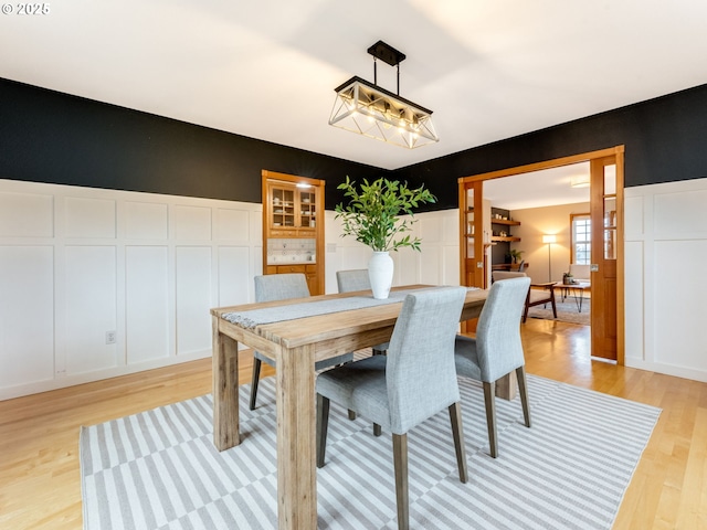 dining area with light hardwood / wood-style floors