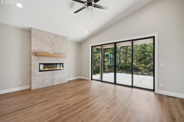 559 Meadows Dr, Manzanita, OR 97130 - unfurnished living room with baseboards, light wood-type flooring, high vaulted ceiling, a ceiling fan, and recessed lighting