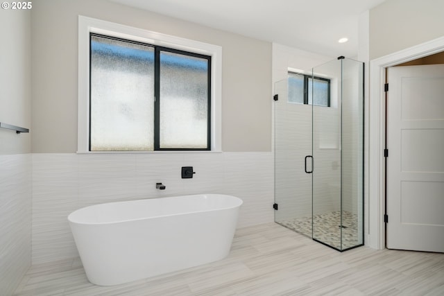 559 Meadows Dr, Manzanita, OR 97130 - full bath featuring a shower stall, a freestanding bath, and tile walls