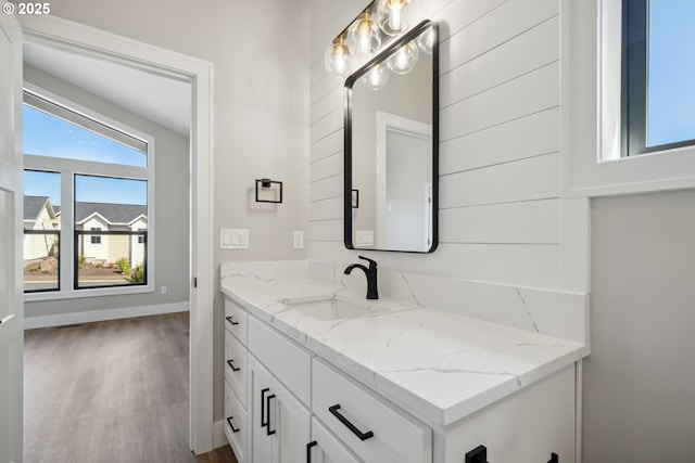 559 Meadows Dr, Manzanita, OR 97130 - bathroom featuring vanity, wood finished floors, and baseboards