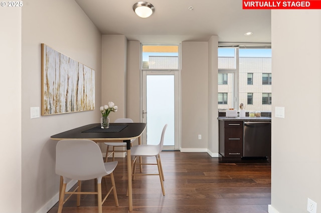1930 S River Dr Unit W504, Portland, OR 97201 - dining area featuring dark wood-style flooring and baseboards