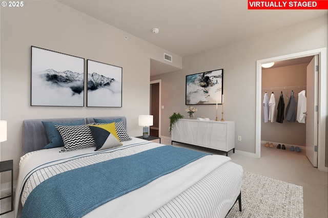 1930 S River Dr Unit W504, Portland, OR 97201 - carpeted bedroom featuring a spacious closet and baseboards