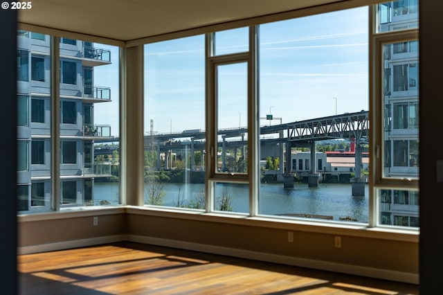 1930 S River Dr Unit W504, Portland, OR 97201 - empty room with a water view, wood finished floors, and baseboards