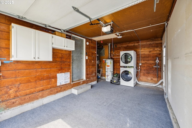 5515 SE 62nd Ave, Portland, OR 97206 - garage featuring stacked washer and clothes dryer, water heater, a garage door opener, and wooden walls