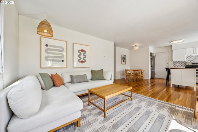 5515 SE 62nd Ave, Portland, OR 97206 - living room featuring wood finished floors