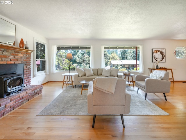 3290 Fillmore St, Eugene, OR 97405 - living area with a textured ceiling, wood finished floors, and a wood stove
