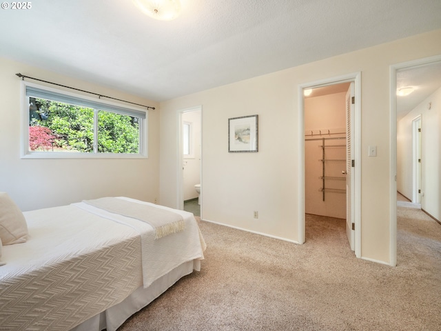 3290 Fillmore St, Eugene, OR 97405 - bedroom with carpet floors, ensuite bathroom, and a walk in closet