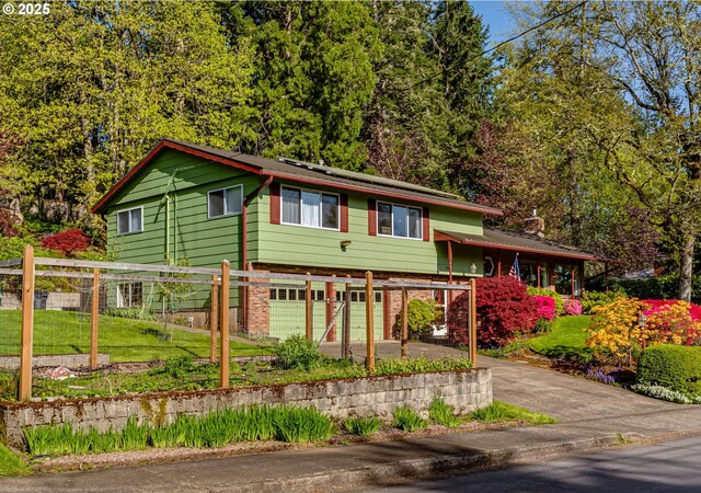 3290 Fillmore St, Eugene, OR 97405 - view of front facade featuring driveway, a garage, and brick siding
