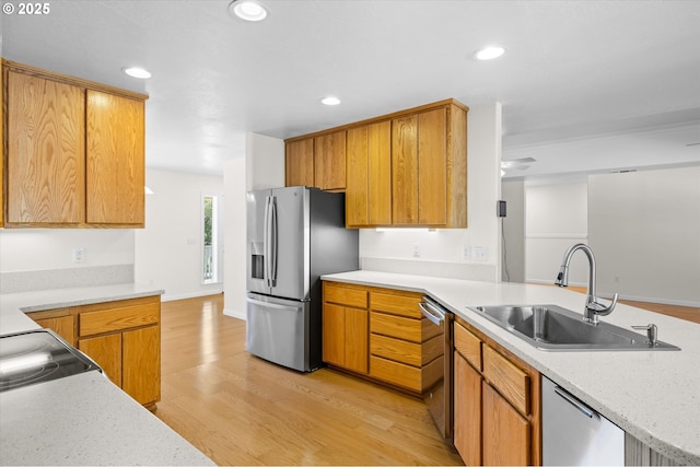 95245 N Bank Rogue River Rd, Gold Beach, OR 97444 - kitchen with stainless steel appliances, light wood finished floors, recessed lighting, brown cabinets, and a ceiling fan