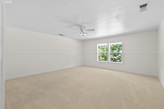 95245 N Bank Rogue River Rd, Gold Beach, OR 97444 - spare room featuring a ceiling fan, light colored carpet, and a textured ceiling