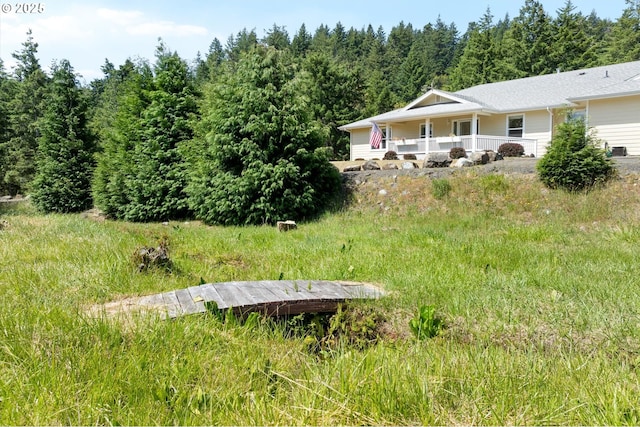 95245 N Bank Rogue River Rd, Gold Beach, OR 97444 - view of yard featuring a porch