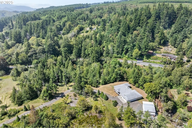 95245 N Bank Rogue River Rd, Gold Beach, OR 97444 - aerial view of property's location featuring a heavily wooded area