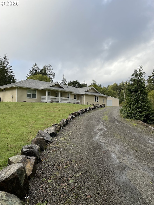 95245 N Bank Rogue River Rd, Gold Beach, OR 97444 - ranch-style home featuring a garage, a front lawn, and driveway
