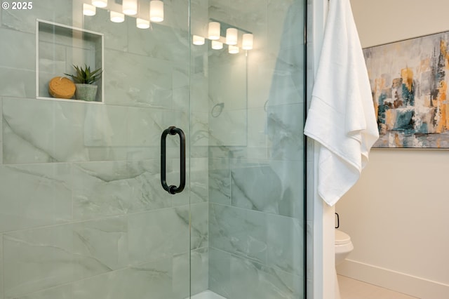 5827 NE 16th Ave, Portland, OR 97211 - bathroom featuring a stall shower, toilet, and baseboards