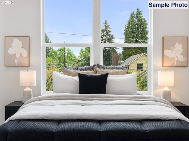 bedroom featuring multiple windows