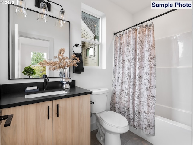 bathroom featuring toilet, shower / bath combo with shower curtain, tile patterned flooring, and vanity