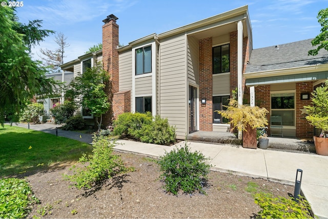 1368 Boca Ratan Dr, Lake Oswego, OR 97034 - view of front of property with a chimney and brick siding