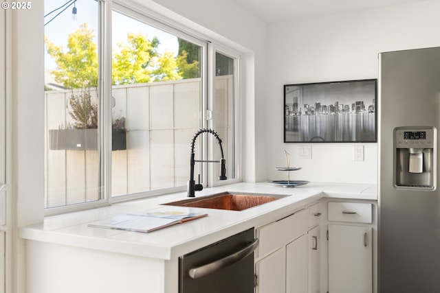 1368 Boca Ratan Dr, Lake Oswego, OR 97034 - kitchen featuring stainless steel appliances, light countertops, white cabinetry, and a desk