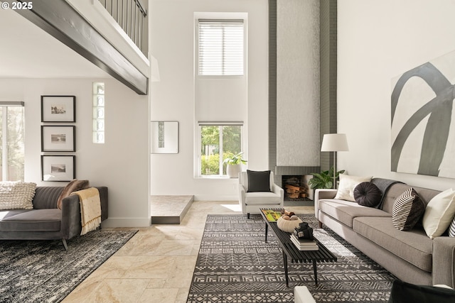 1368 Boca Ratan Dr, Lake Oswego, OR 97034 - living room featuring a high ceiling, stone tile floors, and a brick fireplace