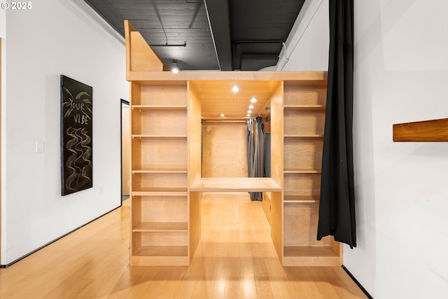 walk in closet featuring light wood-type flooring