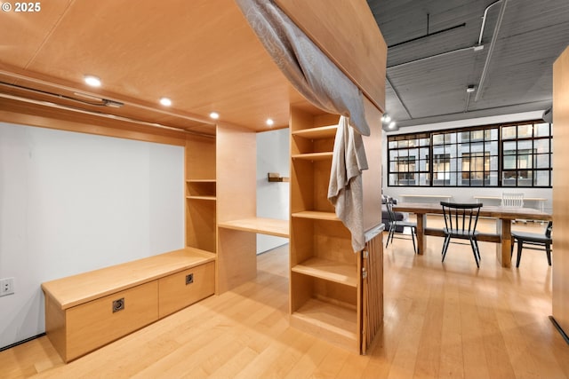 spacious closet featuring light hardwood / wood-style flooring