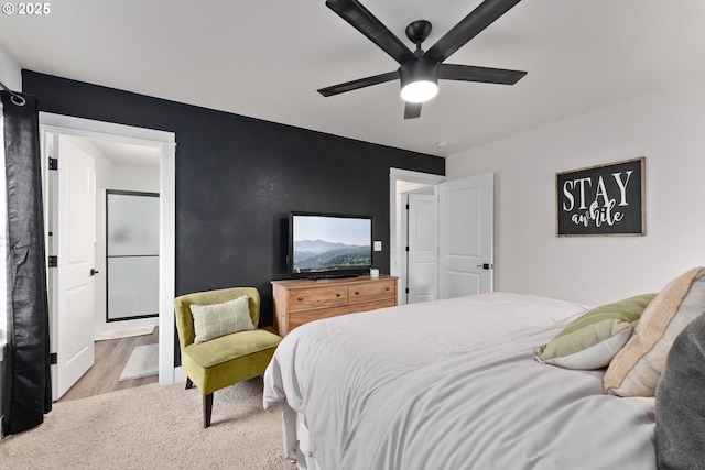 1410 NW Keasey St, Roseburg, OR 97471 - bedroom with wood finished floors, ensuite bathroom, and a ceiling fan