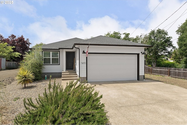 1410 NW Keasey St, Roseburg, OR 97471 - view of front of home featuring driveway, a garage, and a shingled roof