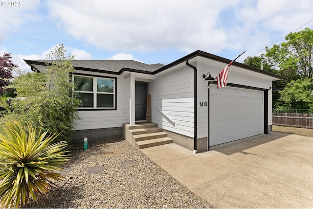 1410 NW Keasey St, Roseburg, OR 97471 - view of front of house with an attached garage and driveway