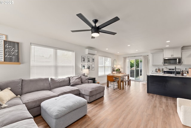 1410 NW Keasey St, Roseburg, OR 97471 - living area featuring a wall mounted air conditioner, a ceiling fan, recessed lighting, and light wood finished floors
