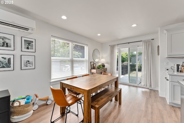 1410 NW Keasey St, Roseburg, OR 97471 - dining space with a wall mounted AC, light wood-type flooring, recessed lighting, and baseboards