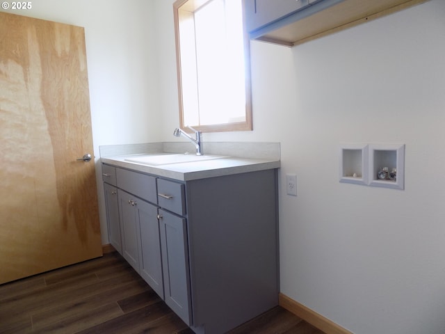 545 SE Firefly Ave, Corvallis, OR 97333 - laundry area featuring hookup for a washing machine, dark wood-style floors, and cabinet space