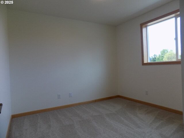 545 SE Firefly Ave, Corvallis, OR 97333 - empty room featuring light carpet and baseboards