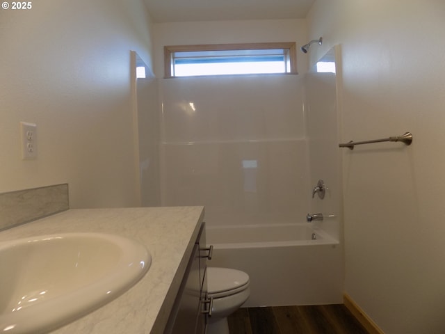 545 SE Firefly Ave, Corvallis, OR 97333 - full bath with vanity, toilet, wood finished floors, and shower / washtub combination