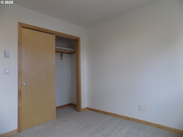 545 SE Firefly Ave, Corvallis, OR 97333 - unfurnished bedroom featuring light colored carpet, a closet, and baseboards