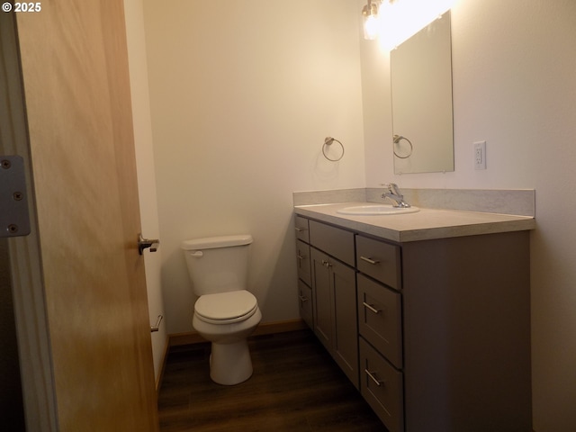 545 SE Firefly Ave, Corvallis, OR 97333 - bathroom featuring vanity, toilet, and wood finished floors