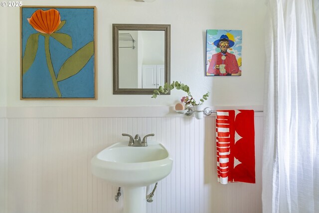 7228 N Villard Ave, Portland, OR 97217 - bathroom featuring wainscoting and a sink