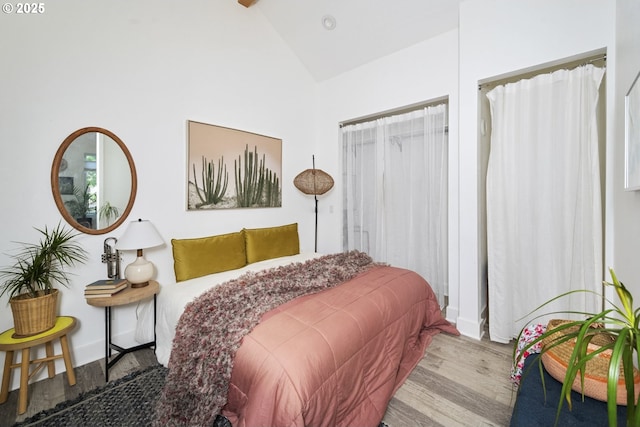 7228 N Villard Ave, Portland, OR 97217 - bedroom featuring wood finished floors and high vaulted ceiling