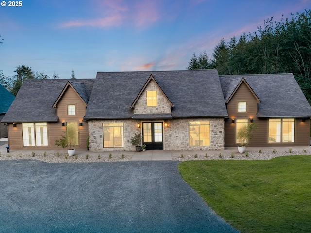 215 Cowlitz Vista Rd, Toledo, WA 98591 - view of front of house featuring stone siding, a yard, and a shingled roof
