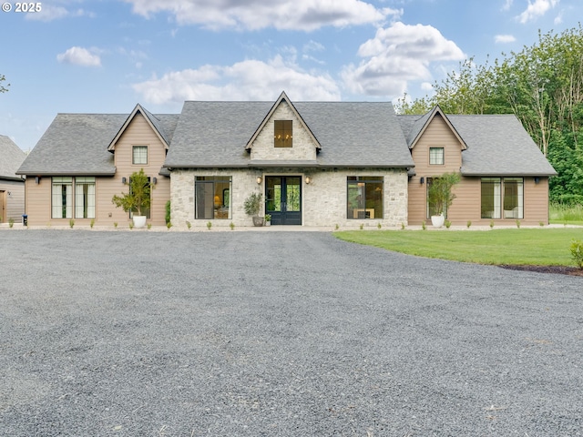 215 Cowlitz Vista Rd, Toledo, WA 98591 - view of front facade featuring french doors, a shingled roof, and a front yard