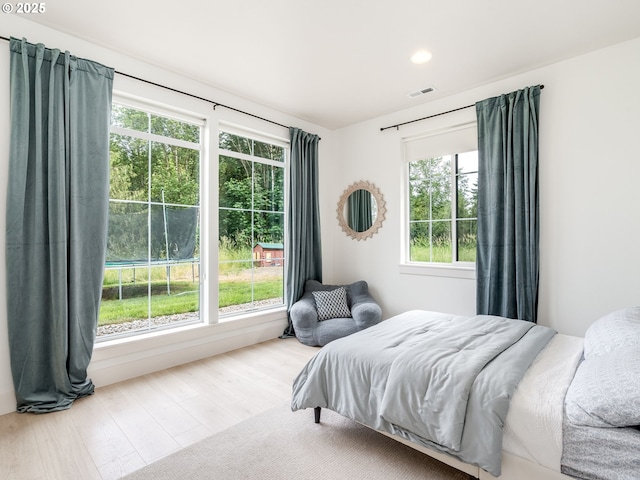 215 Cowlitz Vista Rd, Toledo, WA 98591 - bedroom featuring multiple windows, wood finished floors, and recessed lighting