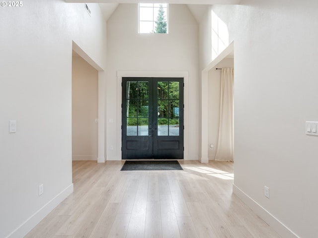 215 Cowlitz Vista Rd, Toledo, WA 98591 - entrance foyer featuring wood finished floors, french doors, and a high ceiling