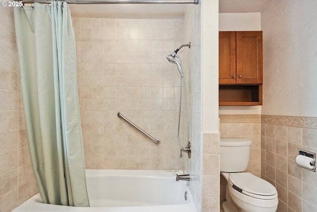 full bathroom featuring toilet, shower / tub combo, and tile walls